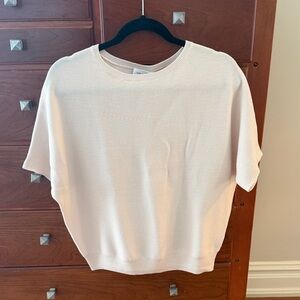 Versatile short sleeve wool sweater from Reset.